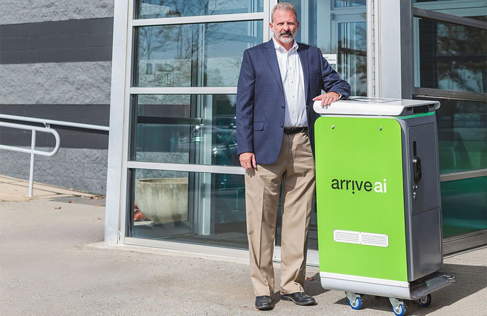 Arrive AI's founder and CEO Dan O'Toole with one of the company's smart mailboxes.