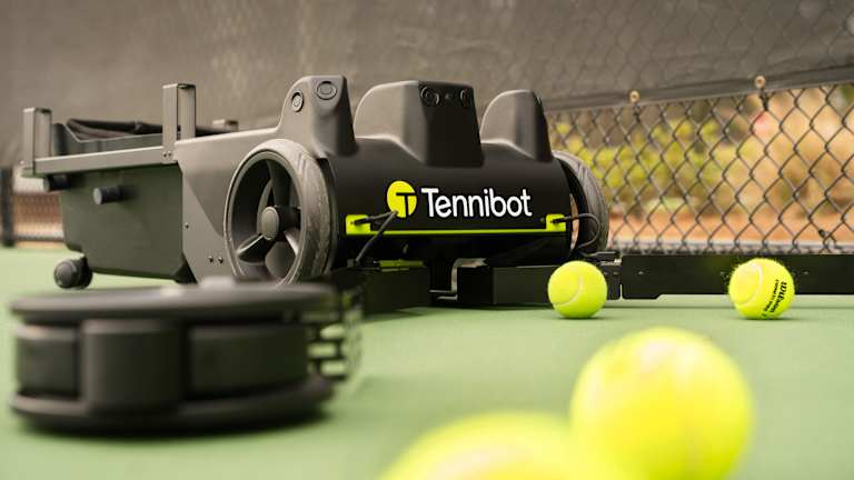 The Rover autonomously seeks out and picks up stray balls on the court, while a sweeper attachment lets it smooth out a clay court.